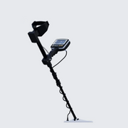 UIG Gold Digger Metal Detector with handheld device and search coil for gold prospecting and treasure hunting.