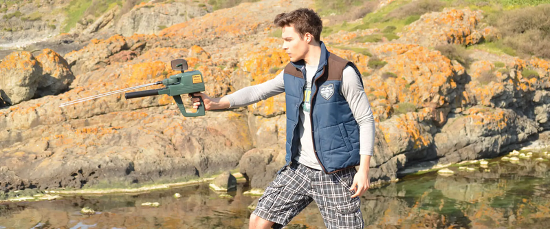 Mega Detection Mega G3 metal detector with adjustable arm and large search coil in outdoor setting.