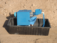 Camel Mining Mountain Goat Trommel spinning with gold recovery sluice, outdoor mining equipment in action.