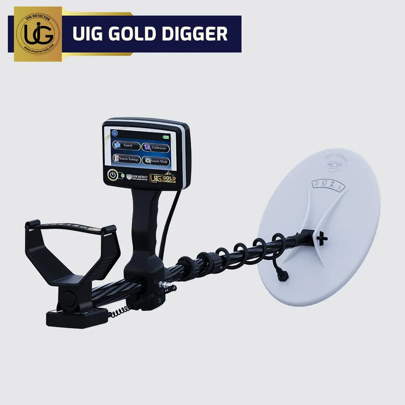 UIG Gold Digger device for detecting gold and precious metals, shown in use with the detector's control panel and search coil visible.